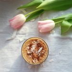 Cacao Coconut Latte next to Tulips